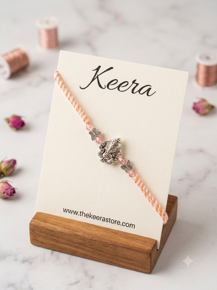 Pastel Ganpati Dori Rakhi - Orange
